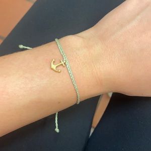 blue and gold bracelet with a gold anchor
